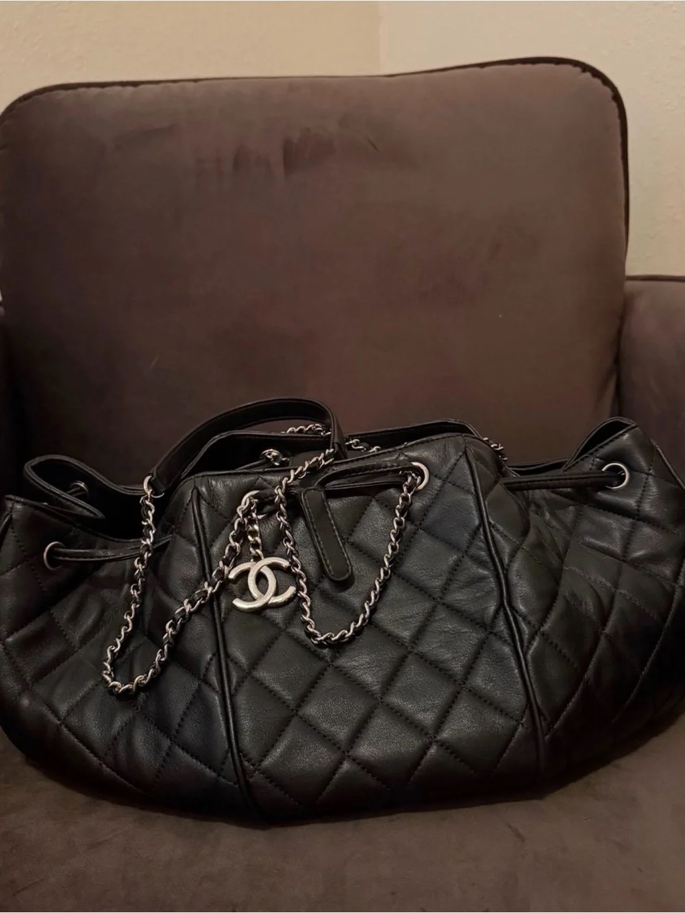 CHANEL Black Quilted Leather Drawstring Shoulder Bag with CC Charm